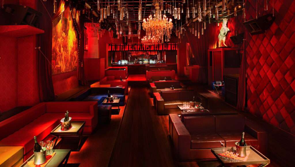 Red room in a lounge. Bottles of Champagne in a bucket