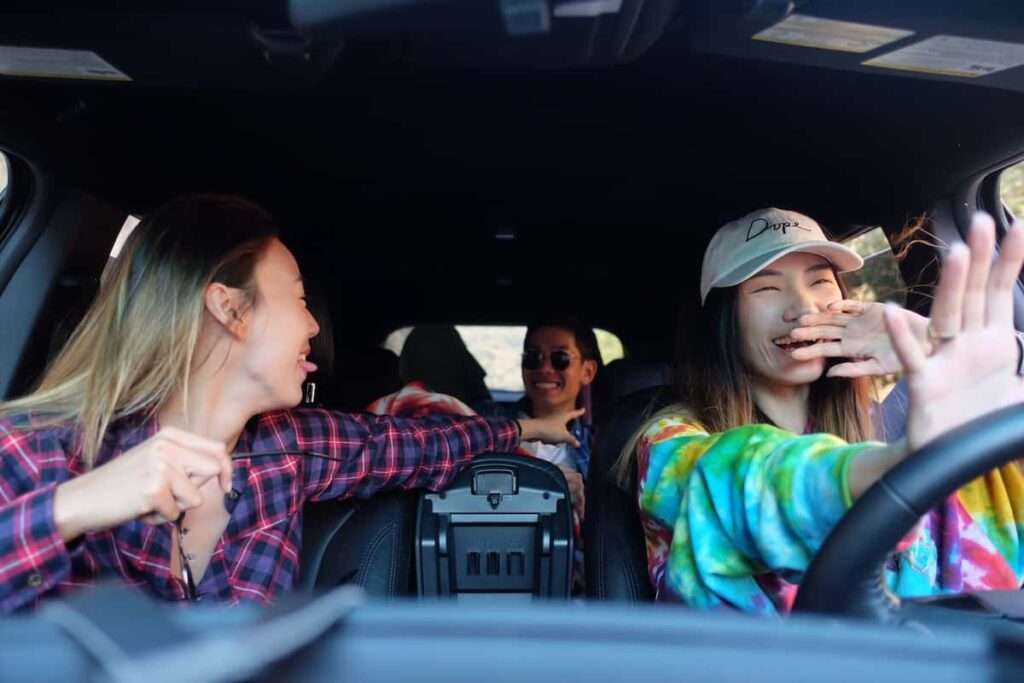 friends riding around in a car laughing